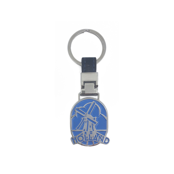 Metalen blauwe sleutelhanger met een windmolen en 't woord Holland. Maat  4x5cm
Metal blue key ring with a windmill and the word Holland. Size 4x5cm